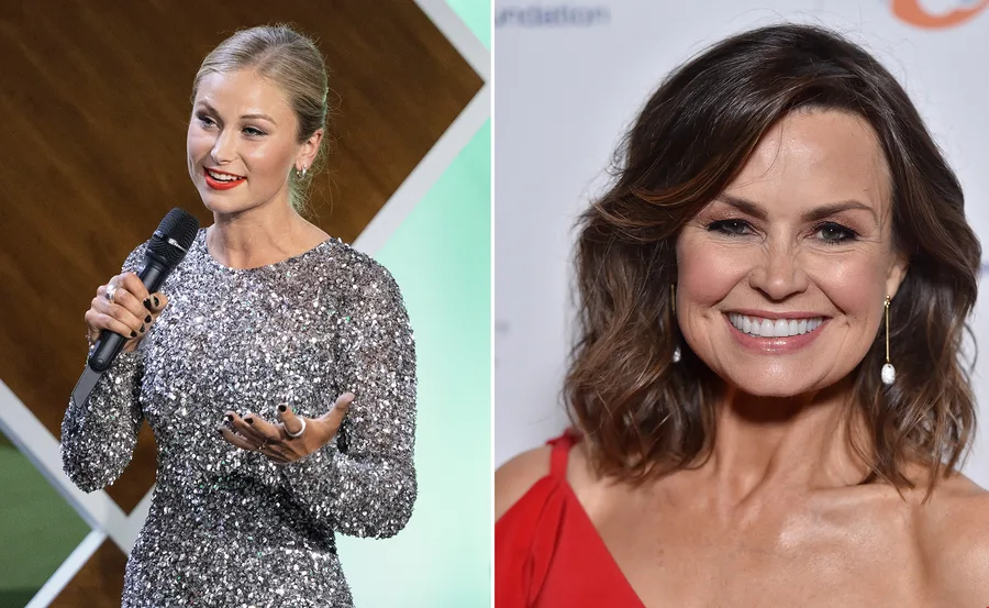 Two women side by side; one speaking into a mic wearing a sparkly dress, the other smiling in a red outfit.