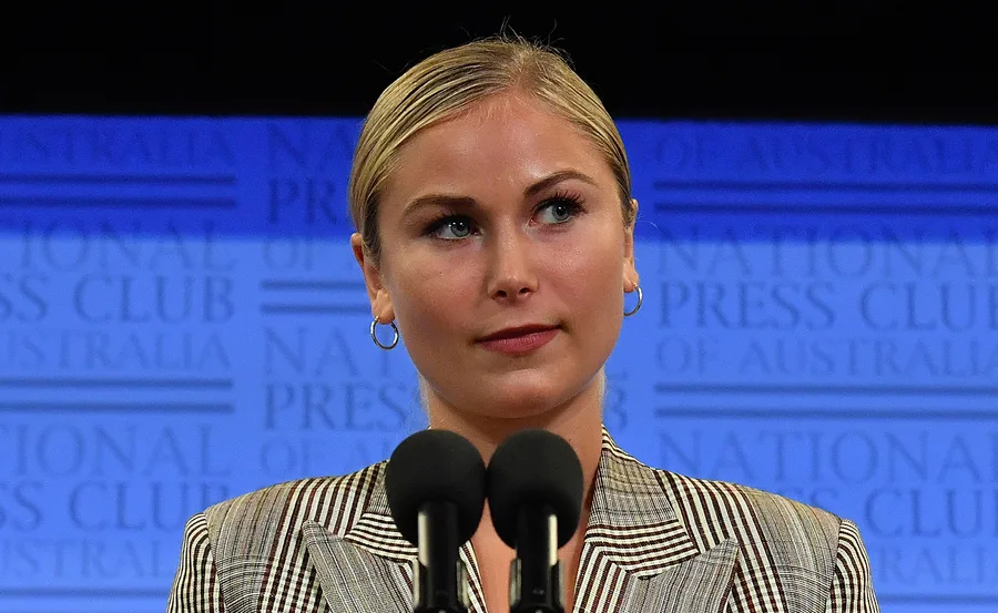 A person speaking at a podium during a National Press Club event.