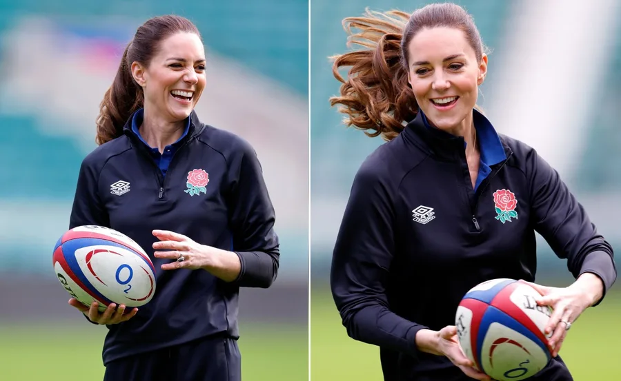 Kate Middleton, wearing an England rugby top, smiles holding a rugby ball at a stadium.