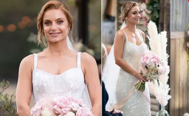 A bride in a sparkly white dress holding a pink bouquet, looking happy outdoors.