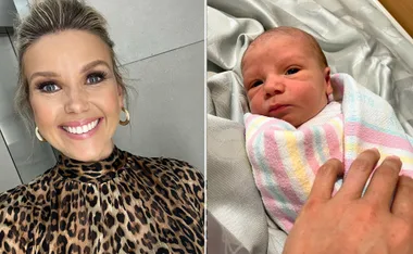Smiling woman in leopard print top beside a newborn wrapped in a pastel-striped blanket.