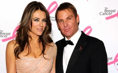 A couple posing at a Breast Cancer Foundation event, dressed in formal attire.