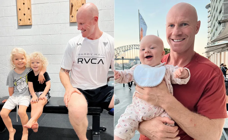 Man with shaved head, wearing a white t-shirt, sitting with two kids, and holding a smiling baby in separate shots.
