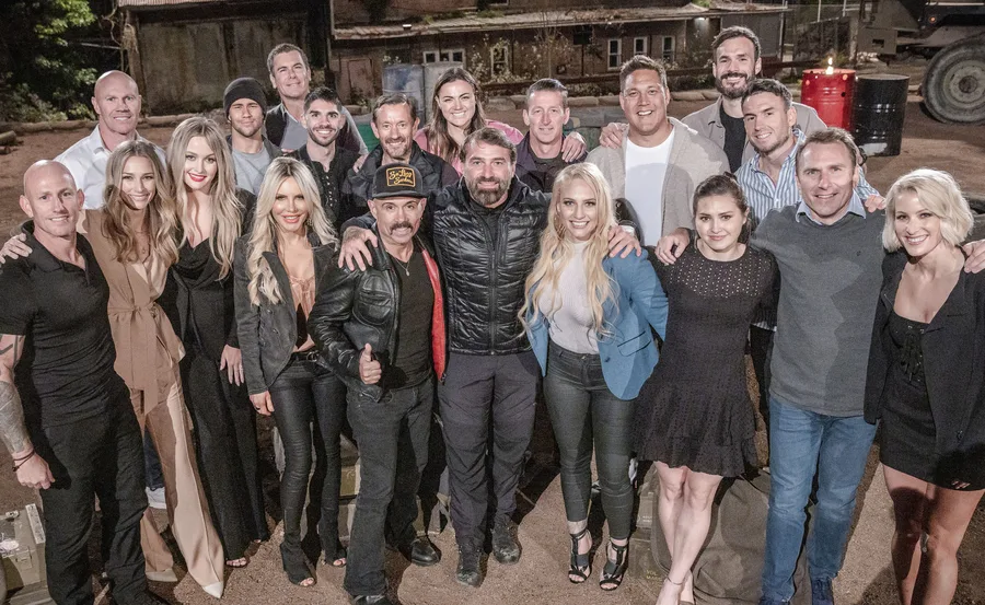 Group photo of SAS Australia 2022 reunion cast standing together outdoors, smiling at the camera.