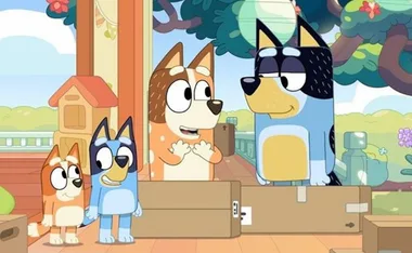 Animated cartoon dogs from the show "Bluey" interacting cheerfully in a colorful backyard setting.