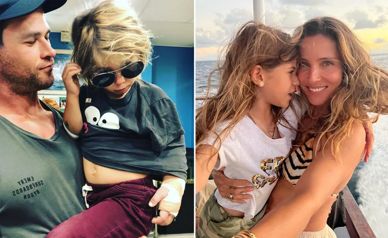 Father holding son with sunglasses; mother hugging daughter on boat, both smiling.