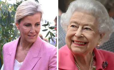 Two women in pink outfits, one with short white hair smiling, the other with blonde hair looking to the side.