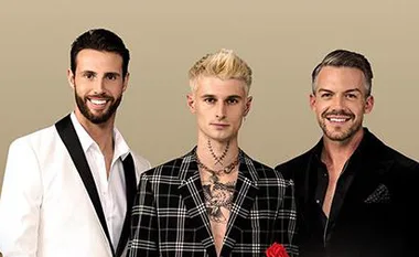 Three men in formal attire, one with a tattooed neck and blonde hair, against a beige background.