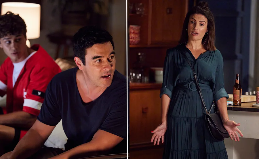 Characters in a heated discussion in a living room; one standing, two seated, with a bottle on the counter nearby.