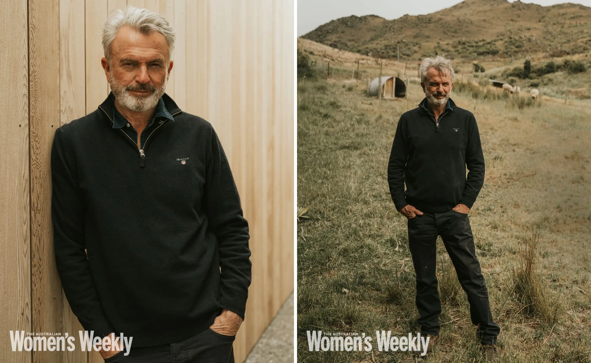Man with gray hair and beard, wearing a black sweater, leans against a wooden wall and stands in a field with hills behind.