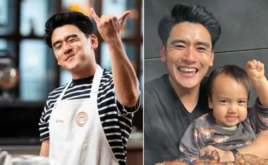 Chef in an apron making a sign and smiling, next to a man with a child also smiling.