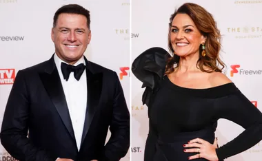 Karl Stefanovic and Chrissie Swan smiling at a TV event, both dressed in elegant evening attire.