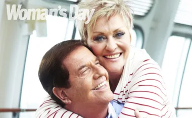 A smiling couple embracing, with a "Woman's Day" logo in the top-left corner.