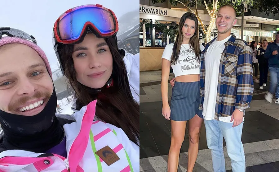 "Couple enjoying ski trip and evening outing, smiling for the camera."