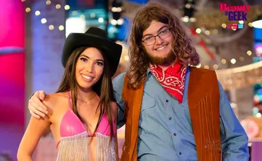 Two contestants from "Beauty and the Geek Australia" 2022, smiling in themed outfits and posing together.