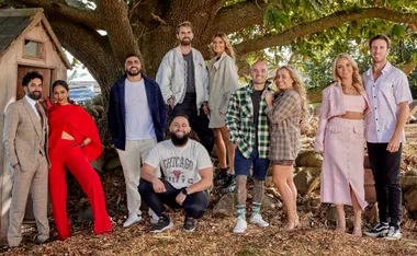 Group of "The Block" 2022 cast members posing outdoors near a tree.
