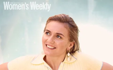 A woman smiling with pearl earrings and wearing a yellow top, on the cover of Australian Women’s Weekly magazine.