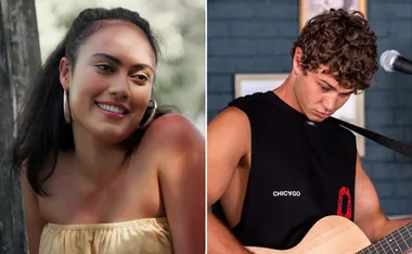 Two characters from "Home and Away": a smiling woman in a yellow top and a man playing guitar in a black sleeveless shirt.