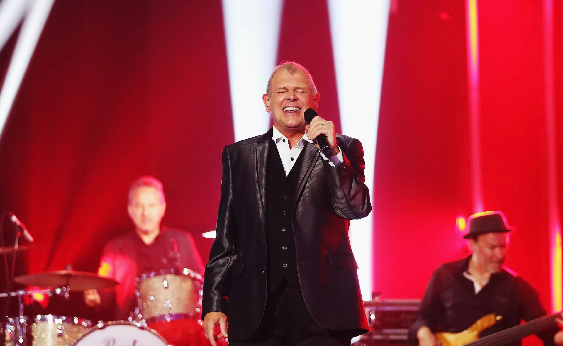 John Farnham stable following surgery to remove a tumour in his mouth