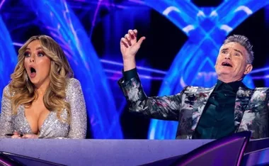 The Masked Singer cops backlash after Hughesy suspiciously correctly guesses the winner’s identity