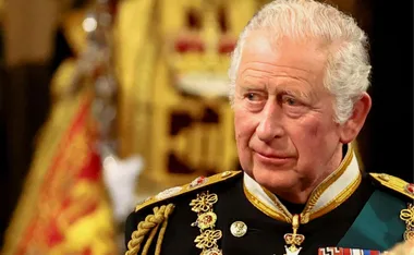 King Charles in ceremonial military attire with ornate decorations.