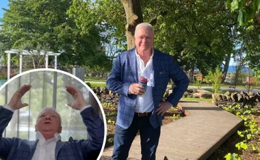 Man in blue suit holds a beverage outside; inset shows him gesturing animatedly indoors.