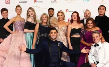 Cast of "Neighbours" pose in elegant attire at a TV Week event.
