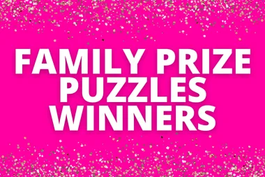 "Bright pink background with text 'Family Prize Puzzles Winners' surrounded by gold and silver sparkles."