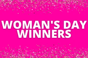 "Woman's Day Winners text on bright pink background with gold glitter accents."