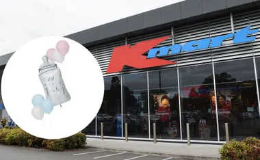 Kmart store with baby shower balloons including a bottle, in pastel pink, blue, and white.