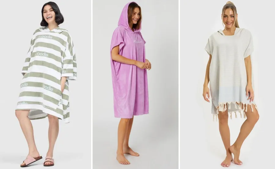 Three women wearing different hooded towel ponchos in various colors and styles.