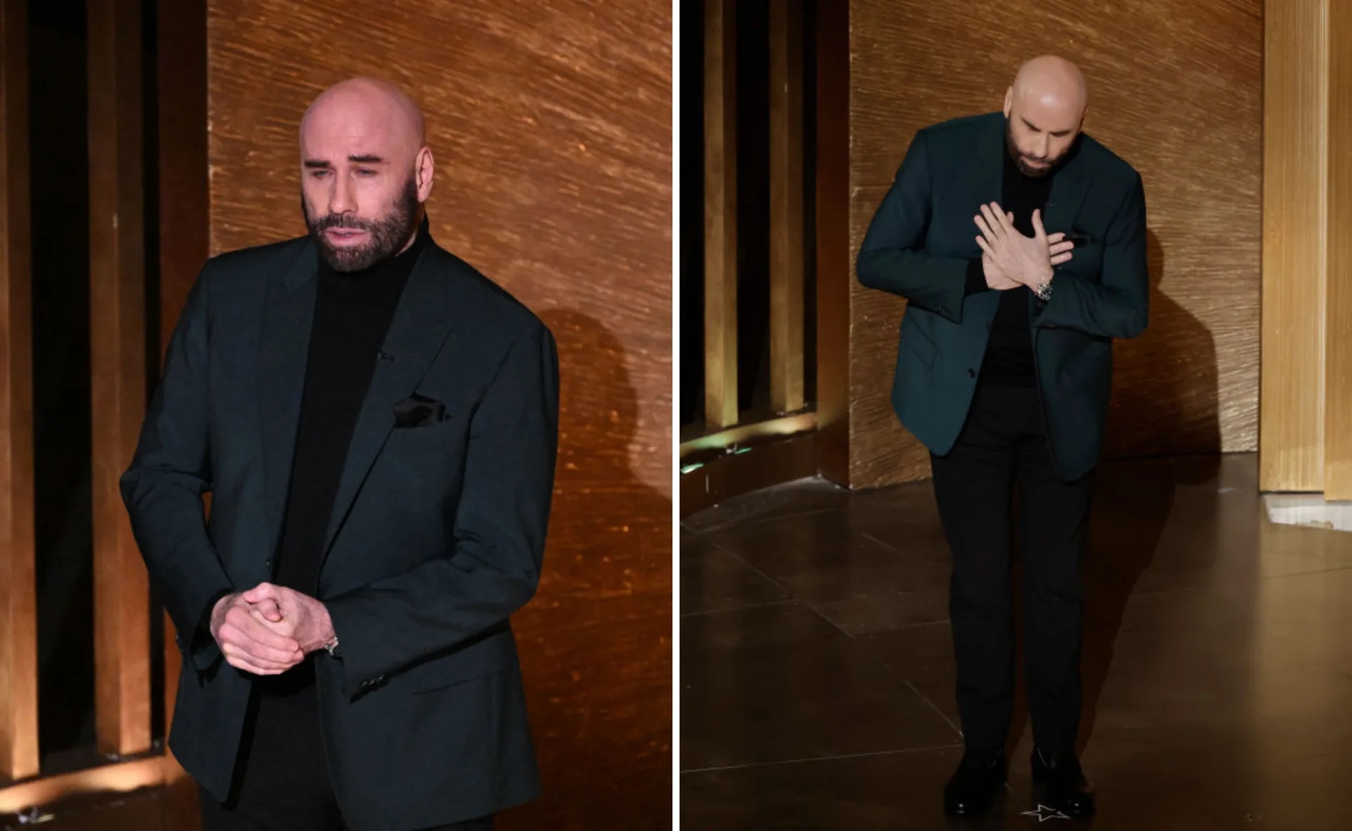 Actor in a dark suit, hands clasped and on chest, standing on stage with a wooden backdrop, appears emotional.