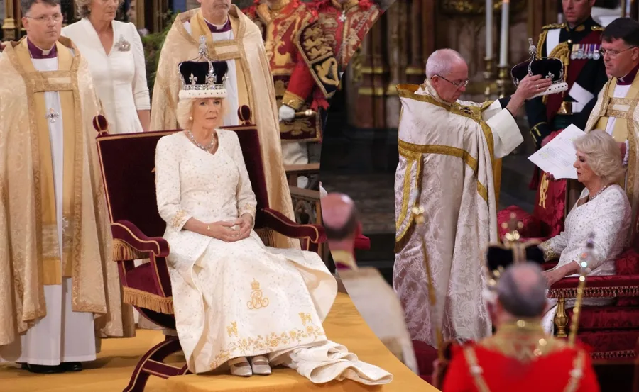 Camilla wearing a crown during a formal coronation ceremony, seated with clergy in ornate robes.