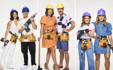 Contestants in construction gear holding tools, wearing colorful hard hats, posing confidently in three groups.