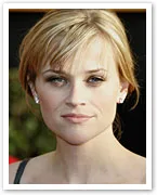 I don't know who this is, but a possible alt text could be: "Blonde woman with earrings looking at the camera."