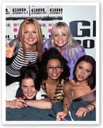Five women posing together at a promotional event for "Girl Power," all smiling at the camera.