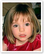 Young child with straight, shoulder-length hair wearing a red dress, looking at the camera.