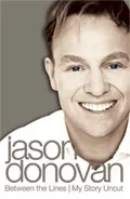 Cover of Jason Donovan's autobiography "Between the Lines: My Story Uncut" featuring his smiling portrait.