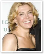 Natasha Richardson smiling in a black dress at an event.