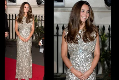 Royalty on red carpet in dazzling silver sequin gown, smiling and posing gracefully for the event.
