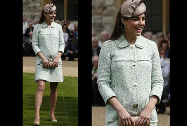 Woman in a light green coat dress and beige hat smiling outdoors, with a hint of a baby bump.