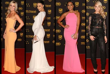 Four women posing in elegant, colorful dresses on the red carpet at the Dally M Awards event.