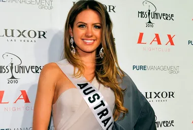 A woman at the Miss Universe 2010 event in Las Vegas, wearing an "Australia" sash and elegant evening dress.
