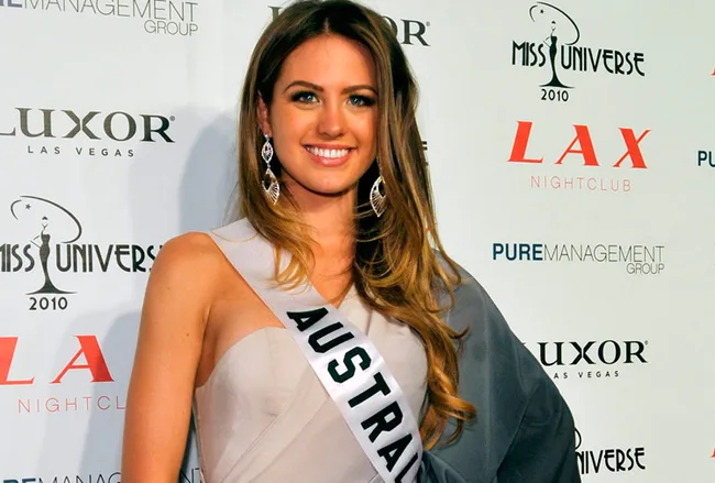 A woman at the Miss Universe 2010 event in Las Vegas, wearing an "Australia" sash and elegant evening dress.