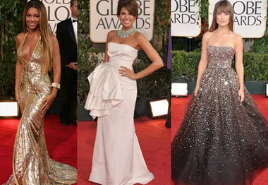 Three women at the Golden Globe Awards in glamorous gold, white, and sparkly gowns on the red carpet.