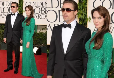 A couple on the red carpet at the 2011 Golden Globe Awards; the woman in a green gown, the man in a black tuxedo.