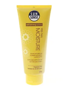 SunSense Pre-Tan Moisture, yellow tube with floral design, for softening skin, enriched with cocoa butter and honey.