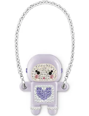 A lilac figurine with a heart design, adorned with crystals, hangs from a chain like a necklace or keychain.