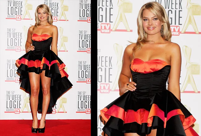 A person in a strapless black and red dress poses on the red carpet at the 51st TV Week Logie Awards.