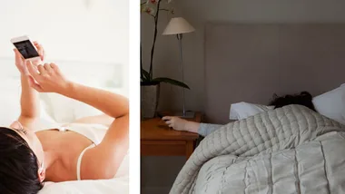 A person using a smartphone in bed; another asleep with a hand reaching toward a phone on a nightstand.